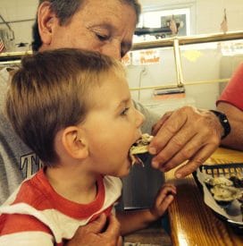 Lynn's Grandson eating a Apalachicola Oyster